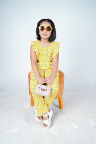 "Girls' Yellow Sleeveless Jumpsuit – All-Over Geometric Print with Ruffle Details"
