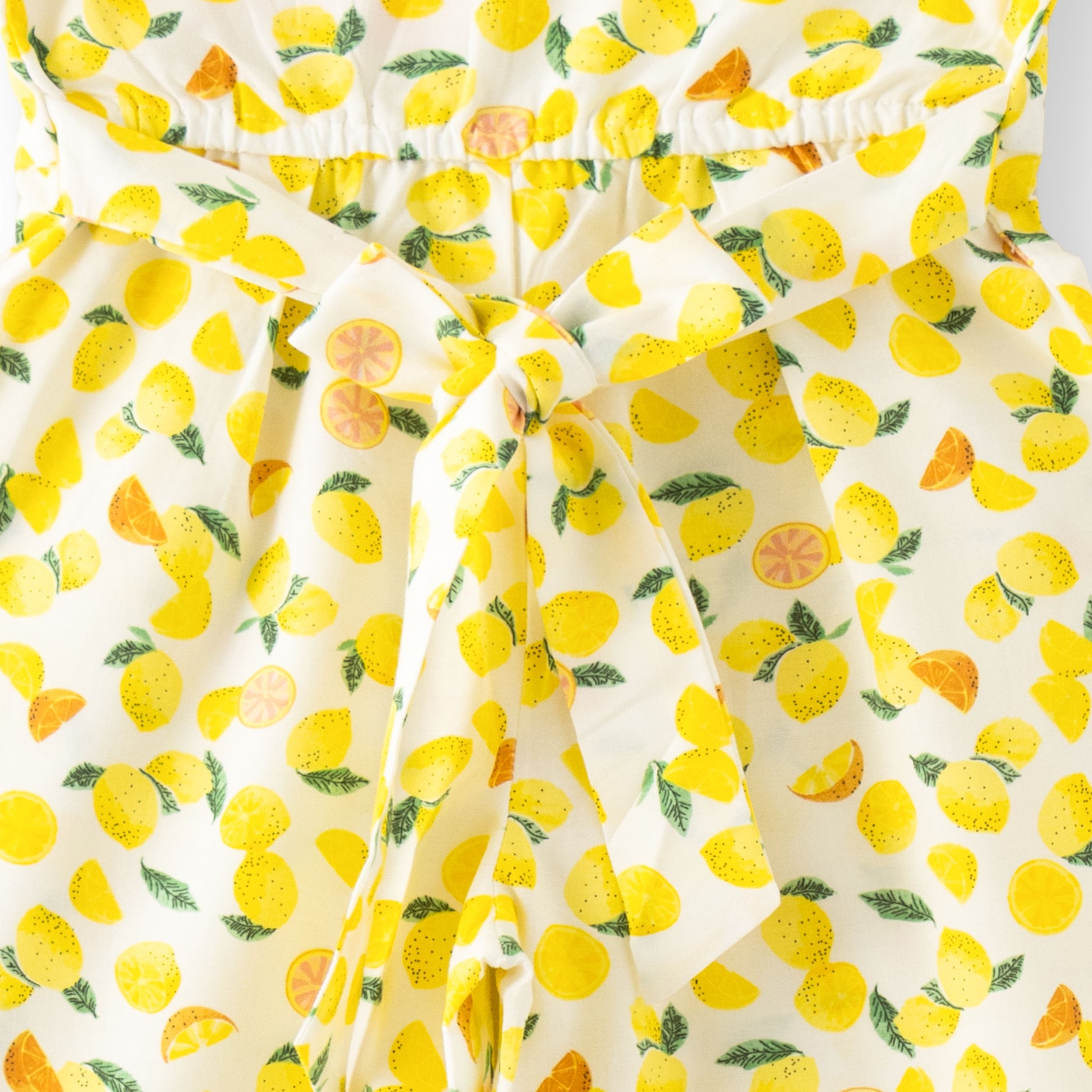 “Girls Cotton Half Sleeve Jumpsuit with Allover Lemon Print – White & Yellow”