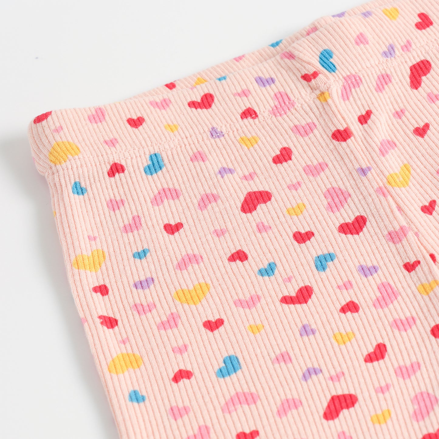 "Girls Pink Ribbed Cotton Leggings with All-Over Multicolor Heart Print"