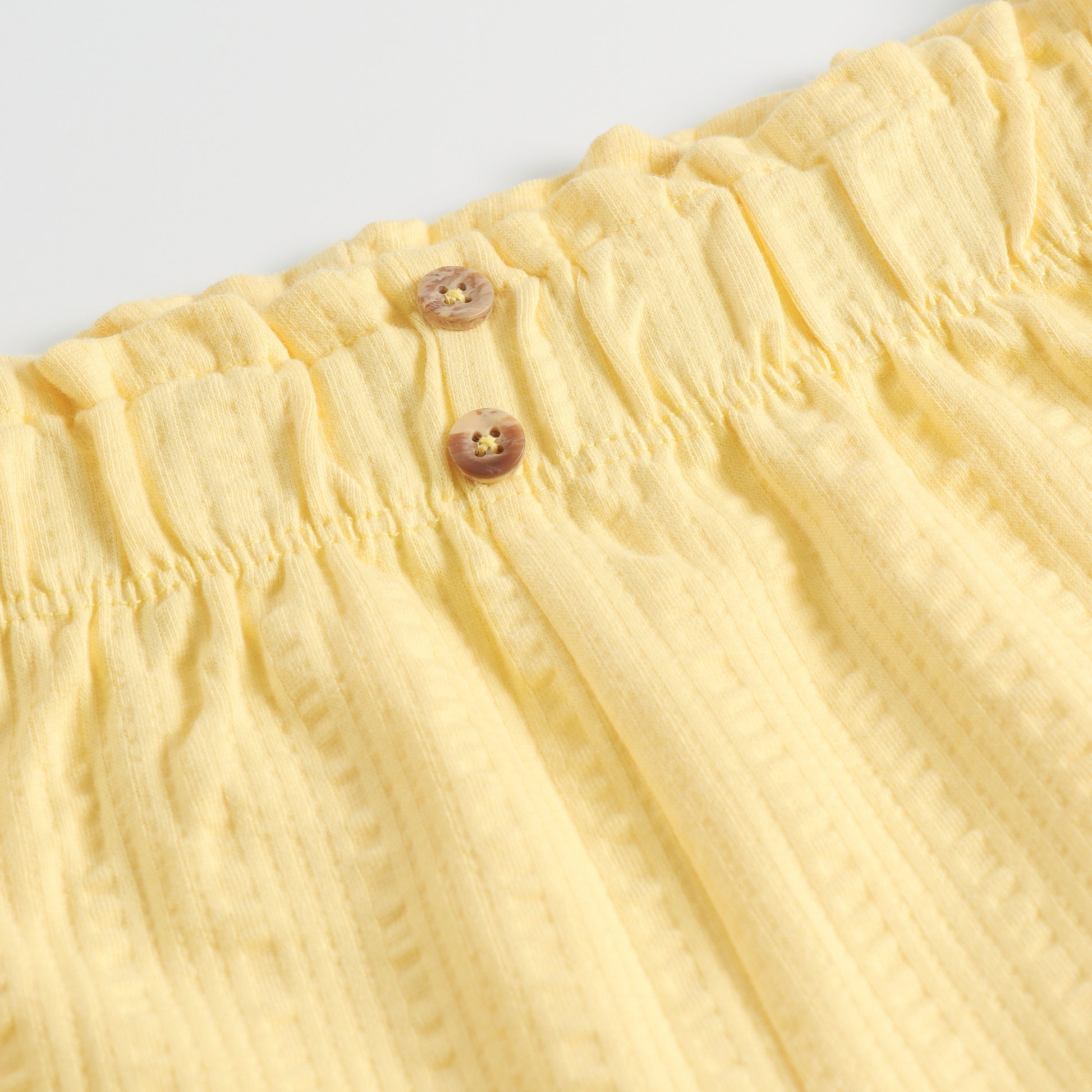 "Girls Yellow Casual Shorts with Stylish Texture, Stretch Waistband & Functional Pocket Design"