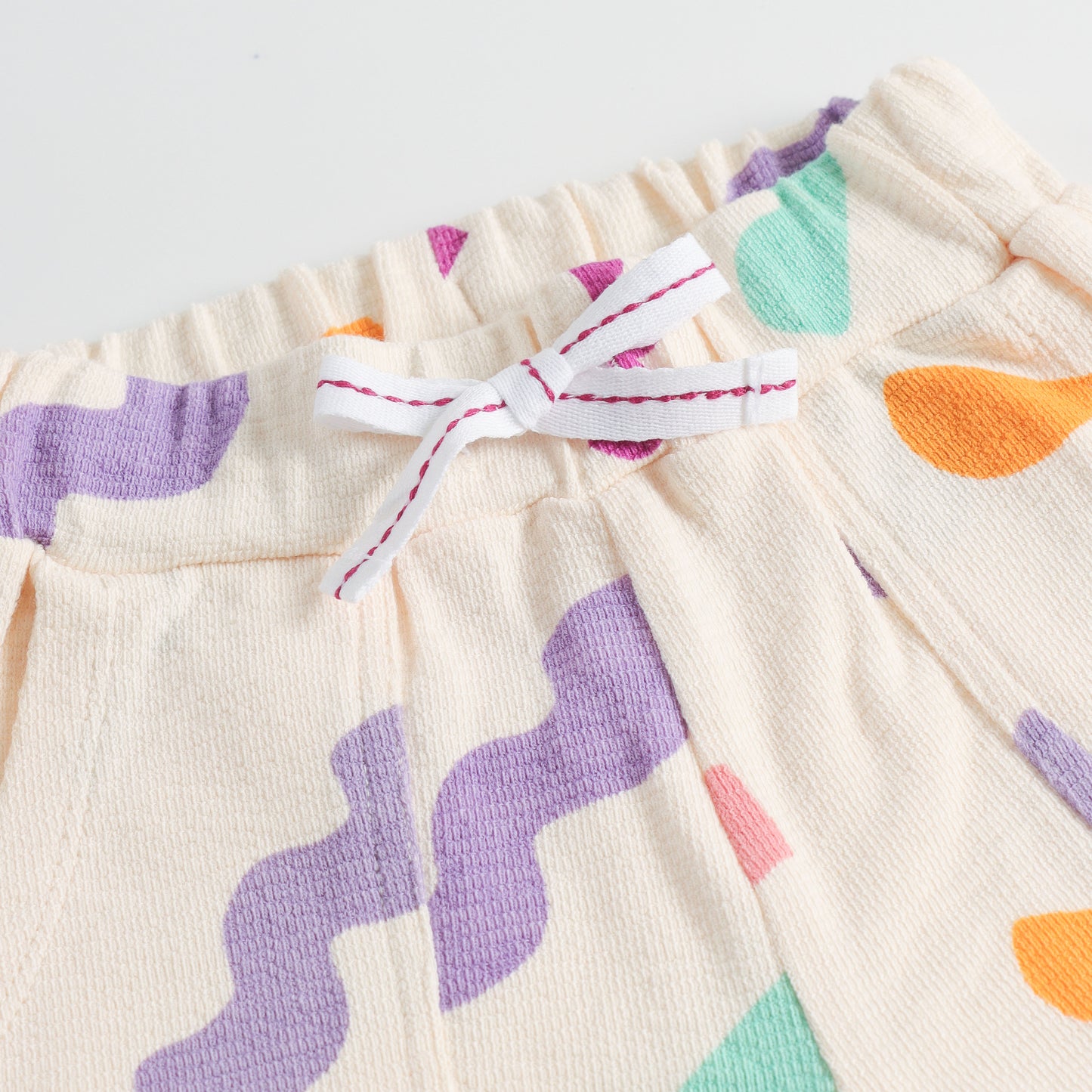 "Girls Multicolor Abstract Print Cotton Jogger Pants with Elastic Waist & Pockets – Soft & Comfortable Daily Wear"