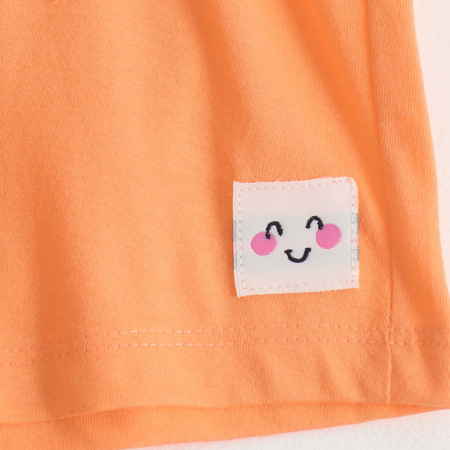 Girls Peach Solid Cotton Knit Regular Fit Shorts with Smiley Patch