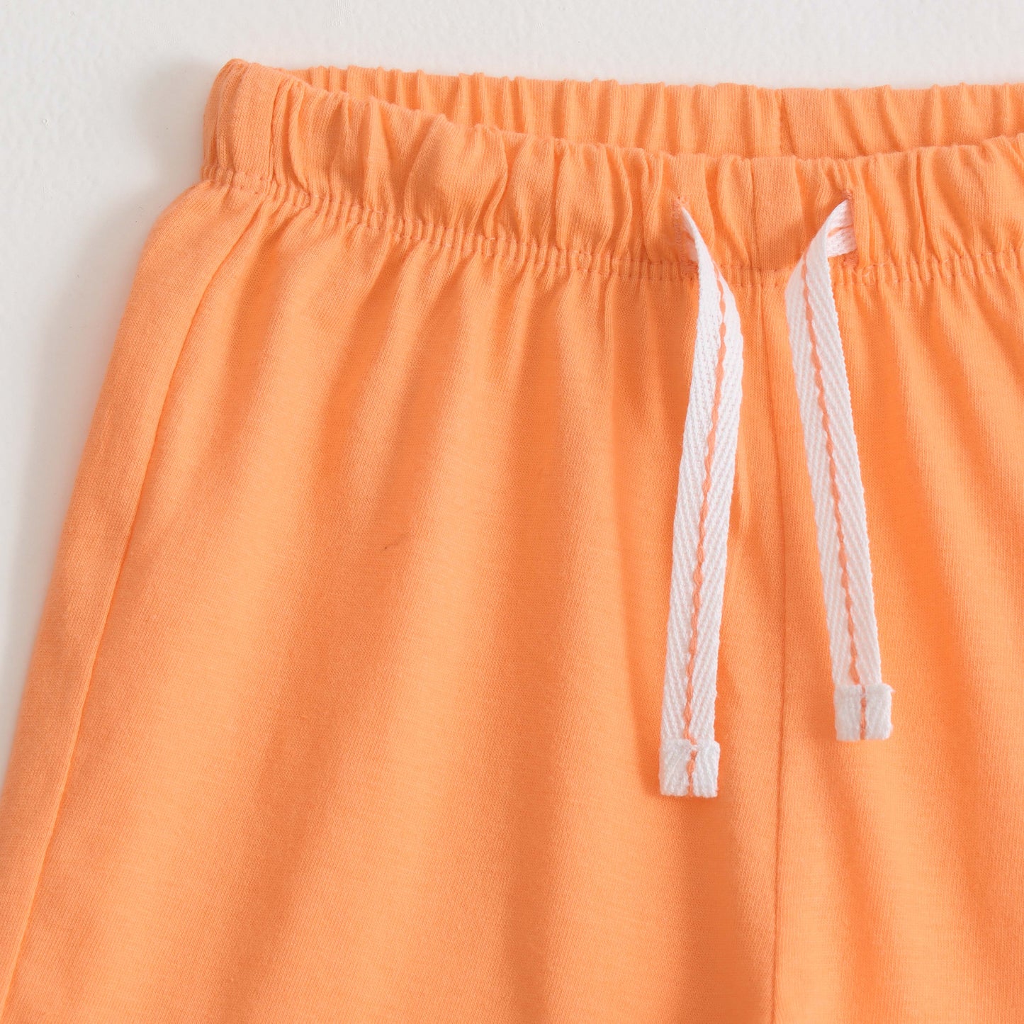 Girls Peach Solid Cotton Knit Regular Fit Shorts with Smiley Patch