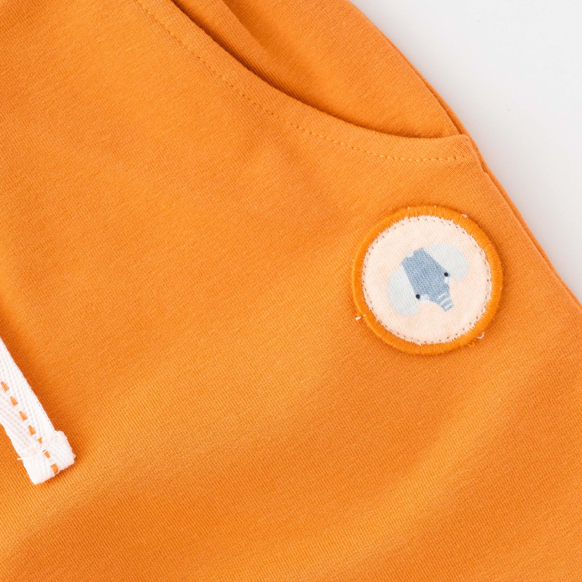 "Baby Boys Organic Cotton Printed T-Shirt with Pocket & Solid Jogger Pants Set – White & Orange"
